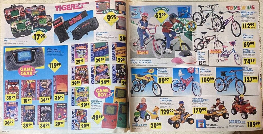 Toys R Us mailer page that shows video games and bikes