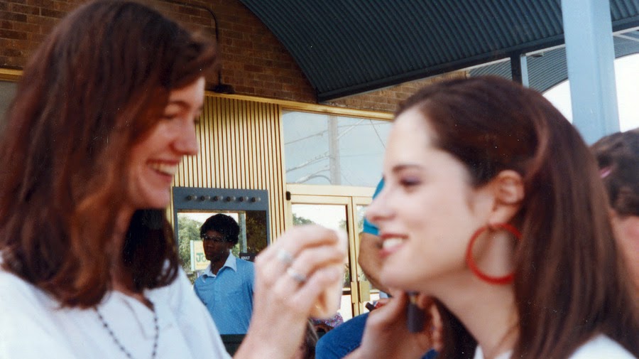 a woman smiling at another woman