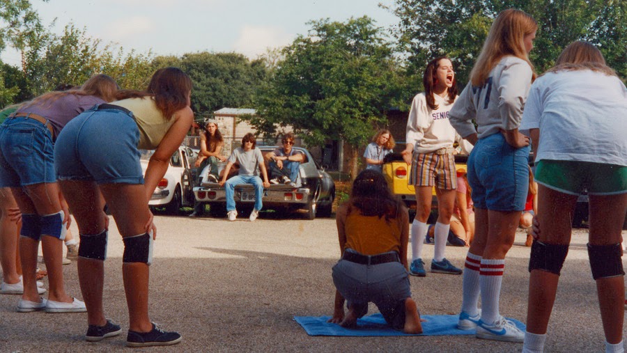 a group of people in a parking lot