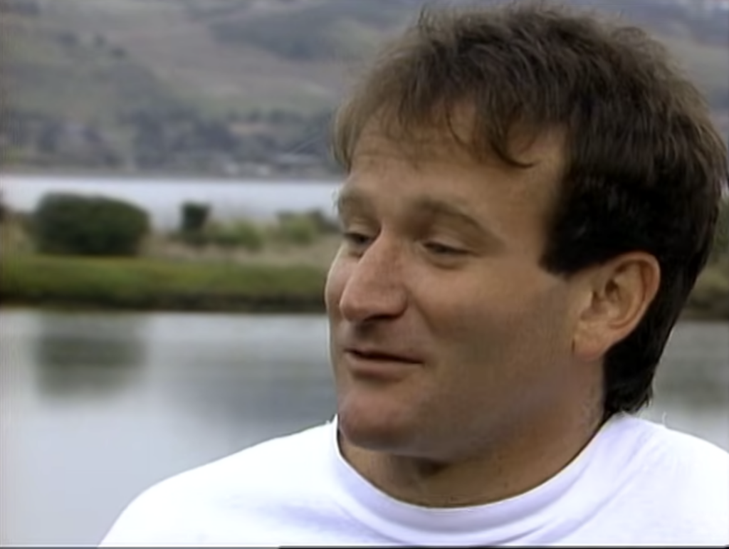 Robin Williams in a white tshirt