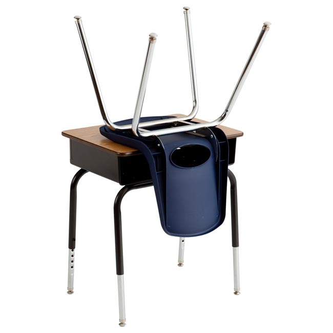 School desk with the chair flipped over on top of it 