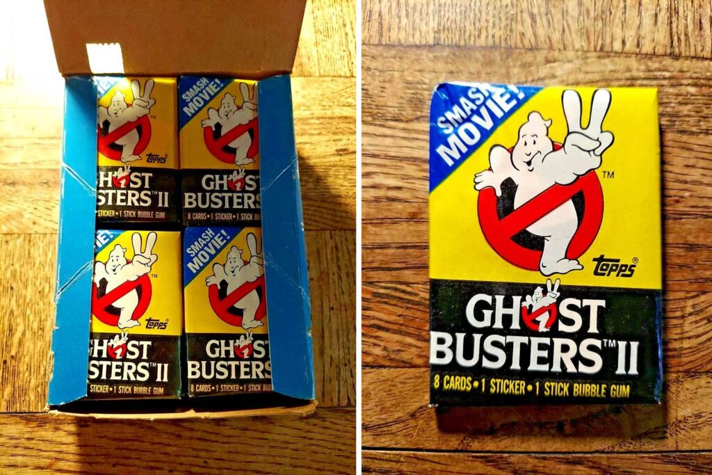 Box containing multiple packs of Ghostbusters II trading cards by Topps, perfect for any Ghostbusters collectibles enthusiast. Each pack includes 8 cards, 1 sticker, and 1 stick of bubble gum. The cover features the iconic Ghostbusters logo with the text "Smash Movie!" on a yellow and black design.