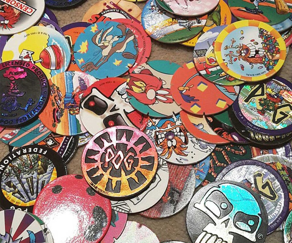 Pile of old pogs including one of Yosemite Sam 