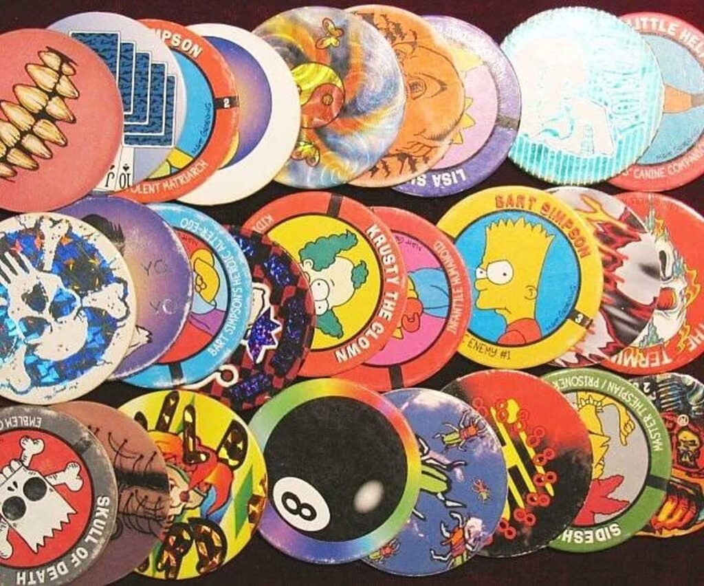 Neatly laid out Pogs including an 8-ball pog and some Simpsons pogs