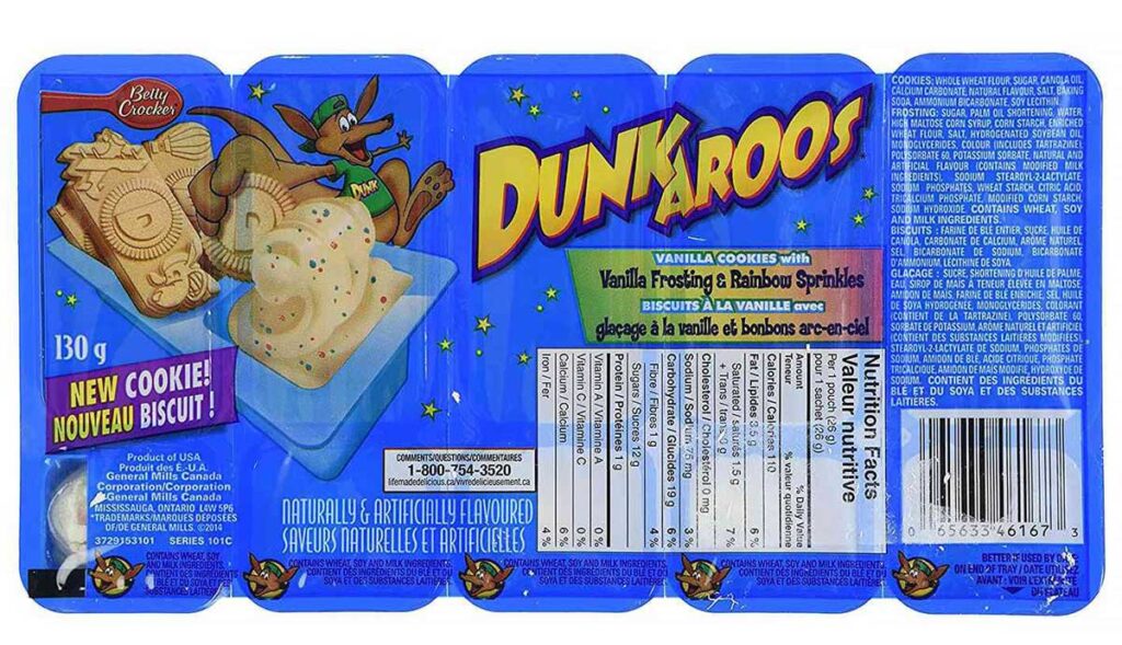 Discontinued snacks from the 90s - Dunkaroos packaging showcases a cartoon kangaroo joyfully clutching cookies, reminiscent of beloved discontinued snacks from the 90s. The box highlights vanilla cookies with vanilla frosting and rainbow sprinkles, while nutritional information and product details adorn the packaging.