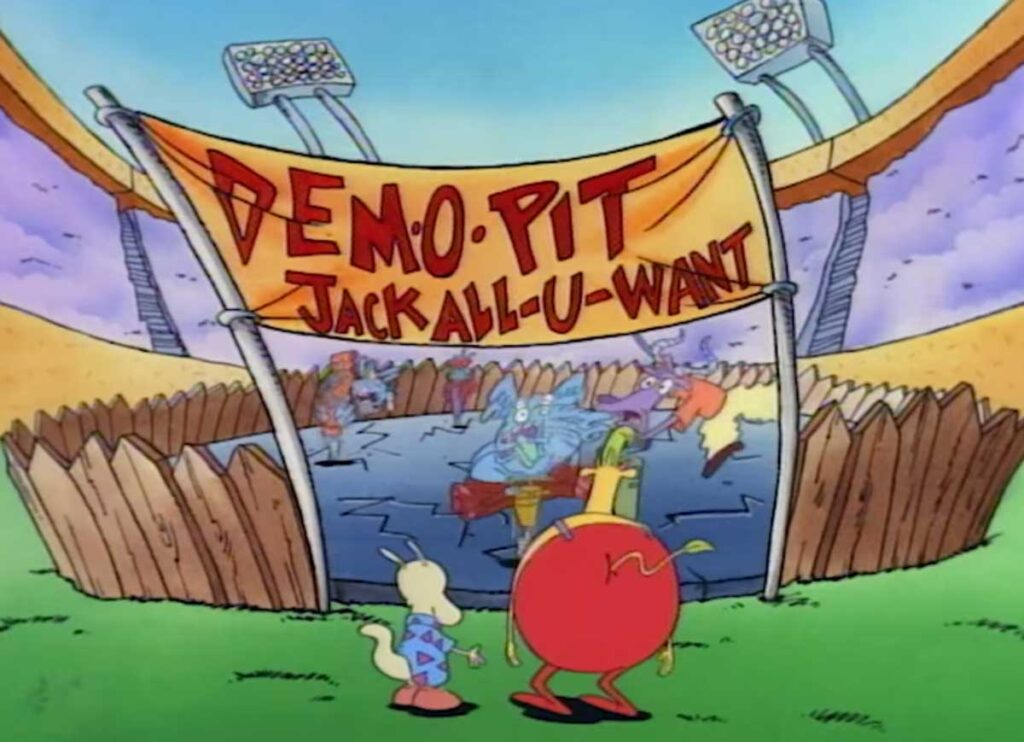 Cartoon characters stand before a Demolition Pit - Jack All-U-Want sign above a muddy pit with vehicles. Large floodlights surround the area, and a wooden fence encloses the demolition zone.