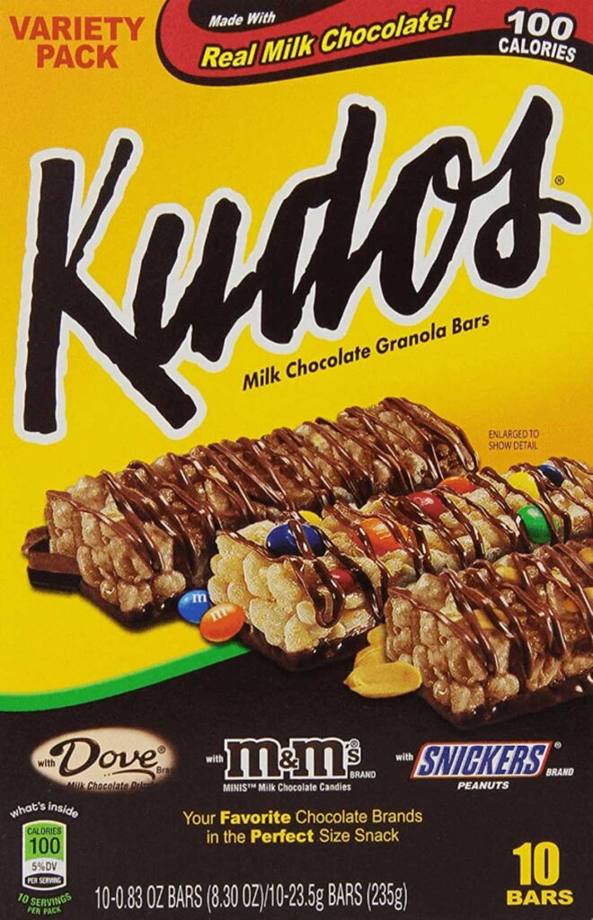 A taste of nostalgia awaits with this box of Kudos granola bars, a delightful throwback to the discontinued snacks from the 90s. Featuring milk chocolate-covered bars with M&Ms, Snickers, and Dove candies, each variety pack contains 10 bars at just 100 calories per bar.