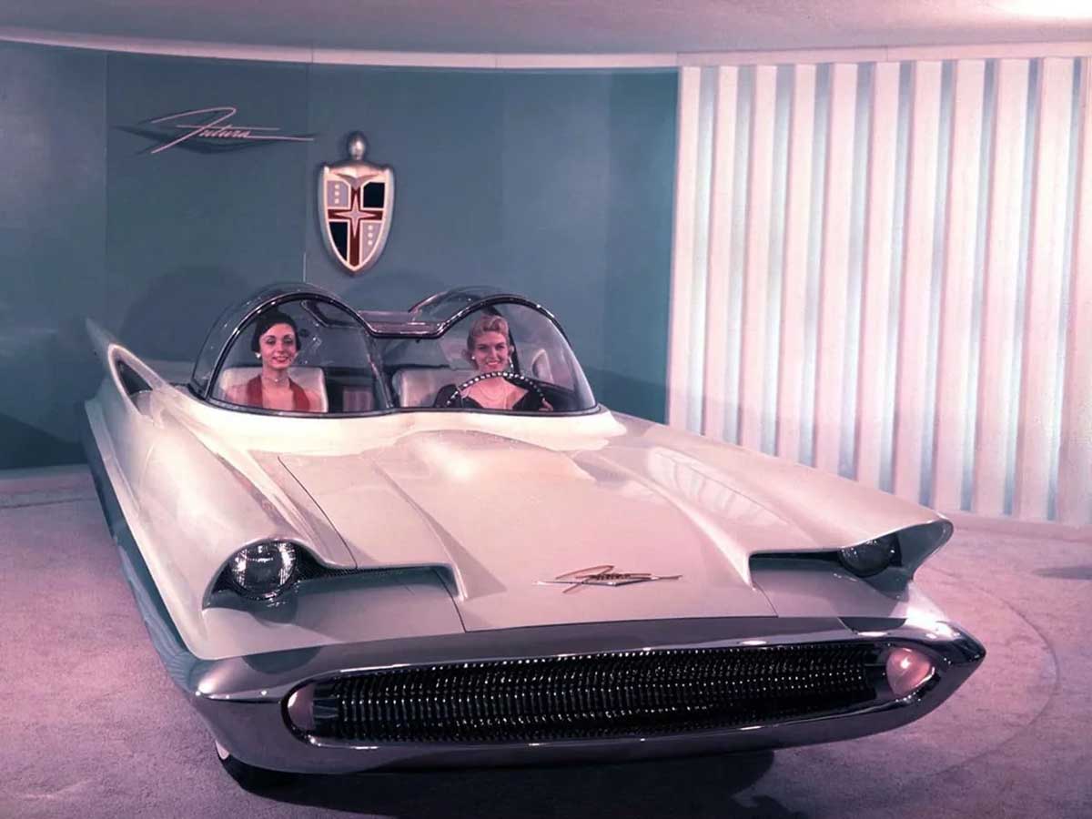 Two women sitting inside a Lincoln Futura (1955) concept car