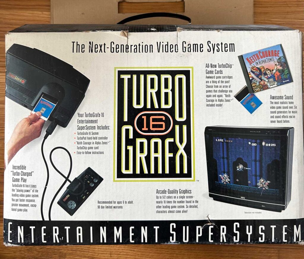 The box of the TurboGrafx-16, one of the best-selling video game consoles, showcases images of the console, controller, and a game on screen. Text highlights features like game cards, graphics, and sound. The predominantly black-and-white design exudes a vintage charm.