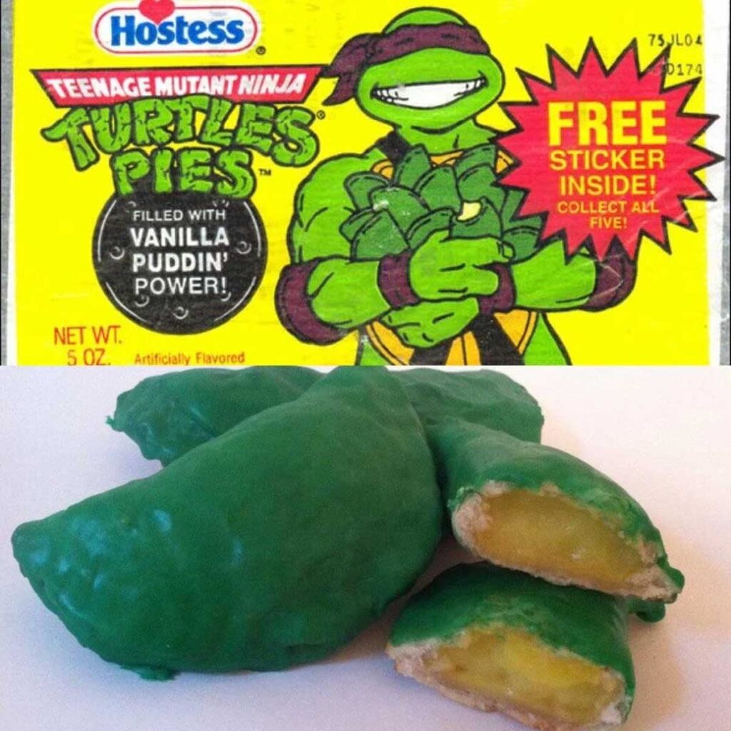 A package of discontinued 90s snacks, Hostess Teenage Mutant Ninja Turtles Pies, features a cartoon turtle holding pies. The box promises vanilla filling and a free sticker inside. Below, three green pies are displayed, one cut open to reveal the nostalgic yellow filling.