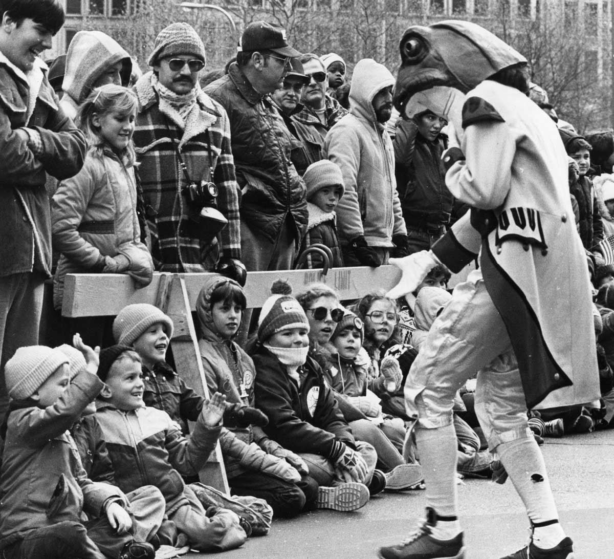 Kids reacting to a man in a frog suit at Gimbel's Parade in 1980