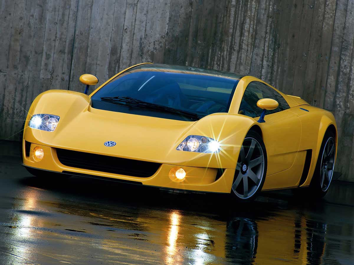 Yellow Volkswagen W12 Syncro (1997) concept car with its lights on