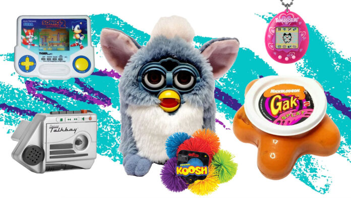 A collage of 90s toys including a blue Furby, Sonic 2 handheld game, Tamagotchi, Gak splat toy, silver Talkboy, and Koosh ball on a vibrant, colorful background.