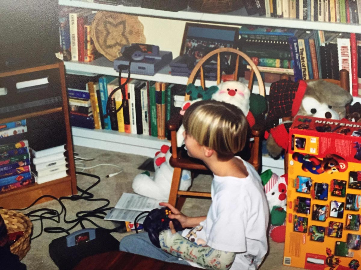 Nostalgic Photos of Christmas Morning in the 90s - Kid playing Zelda Ocarina of Time on a new N64 in 1998.