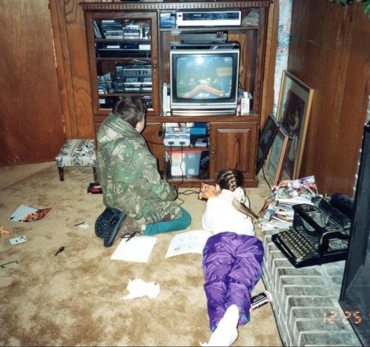 Two kids playing Super Nintendo on Christmas morning in 1993