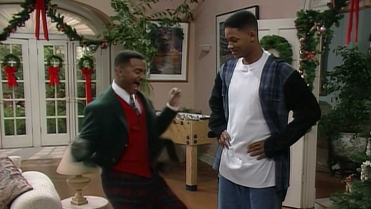 Fresh Prince of Bel Air - Carlton dancing while dressed up in a Christmas outfit while Will looks on. The house is decorated for Christmas. 