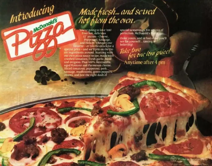 A vintage McDonald’s ad features a close-up of a cheesy pizza topped with pepperoni, green peppers, and onions, alongside text promoting the introduction of McDonald’s Pizza, served hot from the oven.