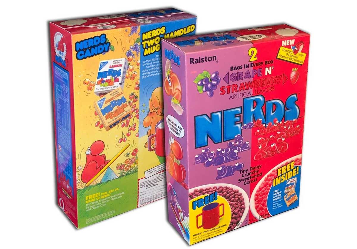 Front and back of a box of Nerds breakfast cereal featuring grape and strawberry themes. Both boxes offer a free mug inside and include playful cartoon graphics of candies and fruit.