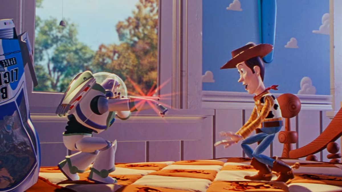 30 Movies Turn 30 - Toy Story movie from 1995 - An animated scene showing a toy astronaut with a red laser beam facing a cowboy doll on a bed in a childs room. Sunlight streams through the window, casting a warm glow, with a large blue and white bag on the bed.