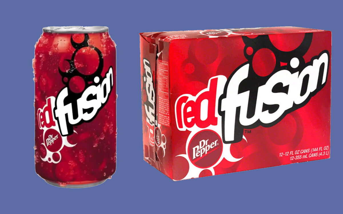 A can of Red Fusion Dr Pepper with condensation next to a 12-pack box of the same drink on a blue background. The packaging is red with a bold white and black logo.