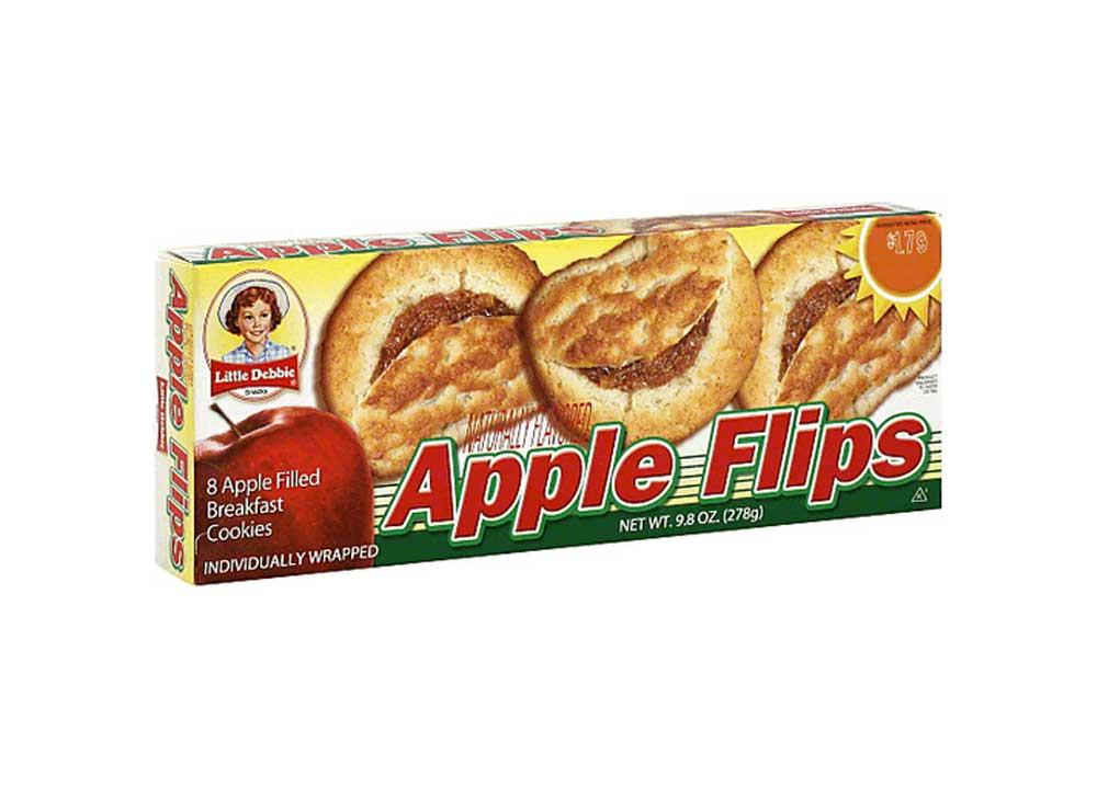 Box of Little Debbie Apple Flips, featuring images of apple-filled breakfast cookies. The packaging is green and red, showing 8 cookies, individually wrapped, with a price sticker in the top right corner.
