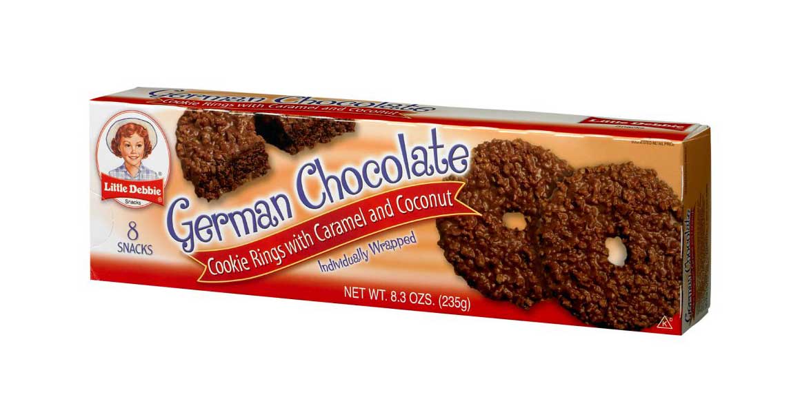A box of Little Debbie German Chocolate cookie rings. The packaging is brown with images of chocolate-covered cookies. Text highlights cookie rings with caramel and coconut and individually wrapped. Contains 8 snacks, 8.3 oz total.