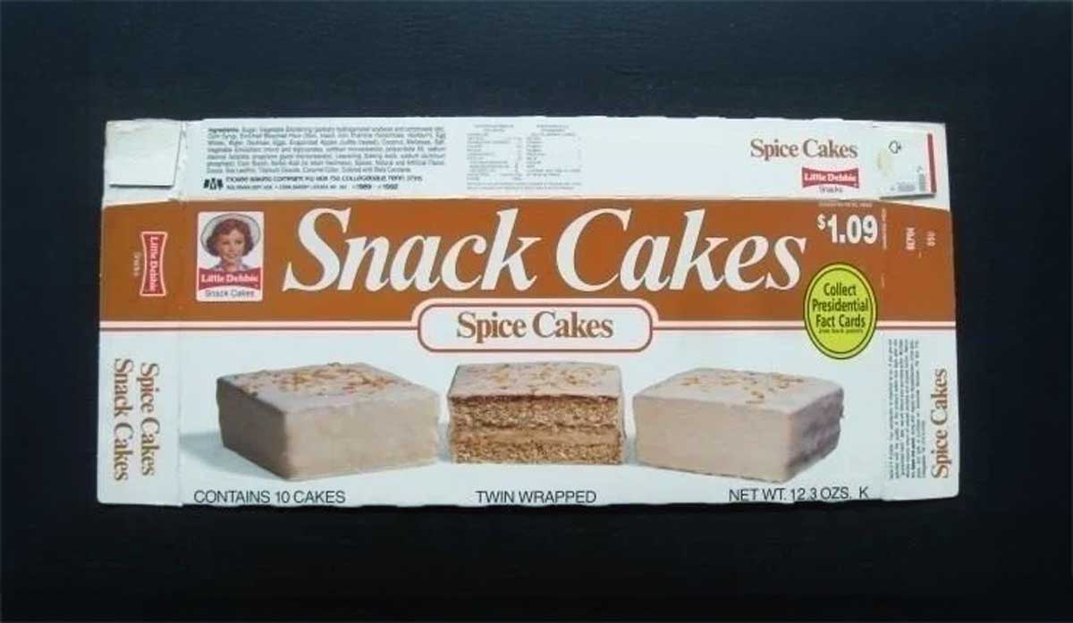 Vintage Little Debbie Spice Cakes box with front design showcasing images of three spice cakes. The box features the price of $1.09, states Contains 10 Cakes, and promotes collecting professional race cards.