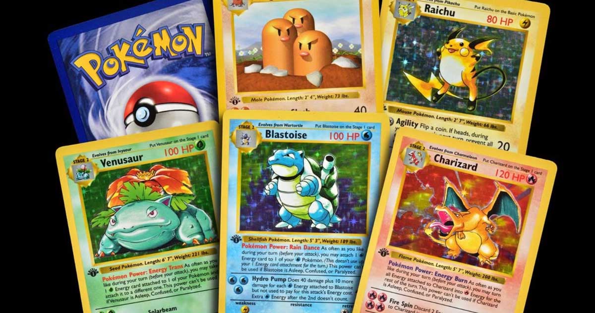 Six Pokémon cards are displayed, including Venusaur, Blastoise, Charizard, Raichu, Dugtrio, and a card showing the Pokémon logo and a Poké Ball. The cards are brightly colored and positioned in a fan arrangement.