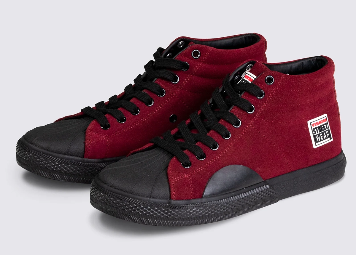A pair of maroon high-top sneakers with black rubber soles, black laces, and black toe caps. There is a white and red Street Wear logo patch on the side and tongue of each shoe.