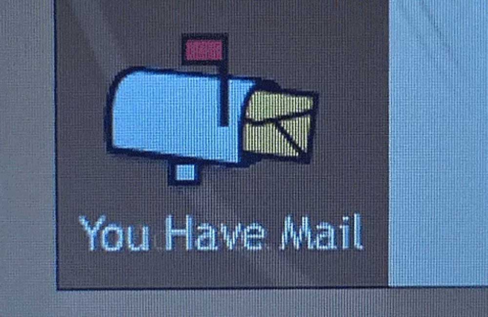 A computer screen displays an icon of a blue mailbox with a red flag and yellow envelopes, accompanied by the text You Have Mail.