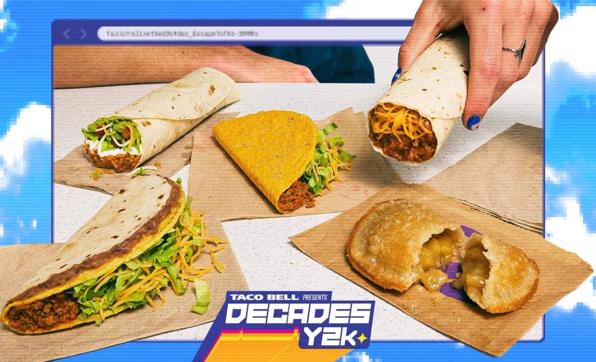 A selection of Taco Bell's y2k menu items, including tacos, burritos, and an apple pie, displayed on brown napkins with a retro 2000s digital background and a “Taco Bell Decades Y2K” logo in the foreground.